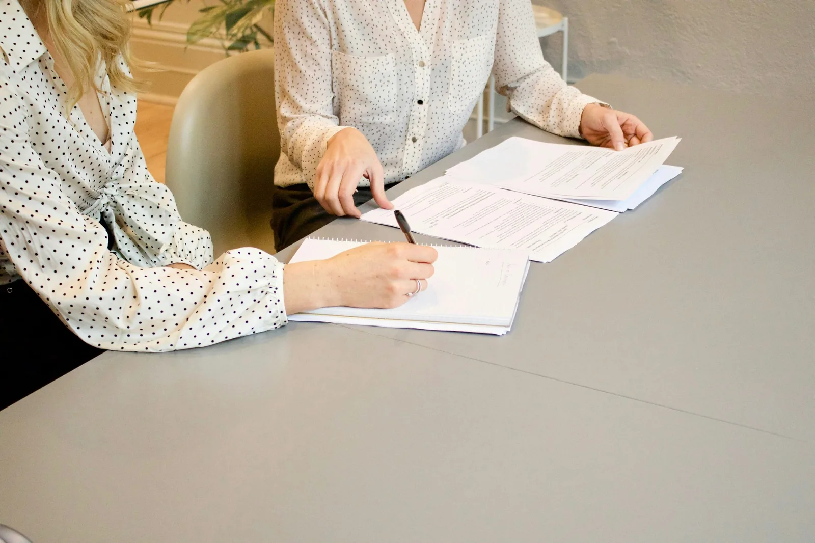 Student and tutor reviewing study papers